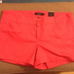 Orange shorts with rolled cuff